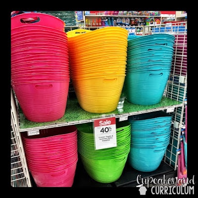 Colorful storage buckets in pink, blue, green, and yellow from Michaels for classroom supplies